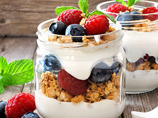 For a quick and satisfying high-protein breakfast, layer  Greek yogurt with berries, nuts and granola.